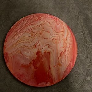 Hand painted orange in color. Paint Pour unfinished back.